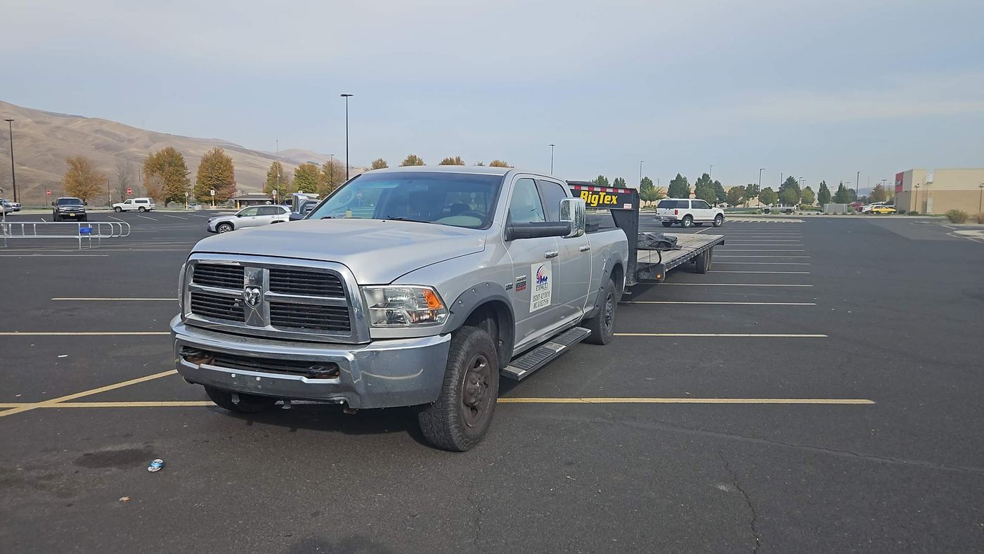 EXMULI Ram 2500 pickup with BigTex gooseneck flatbed trailer